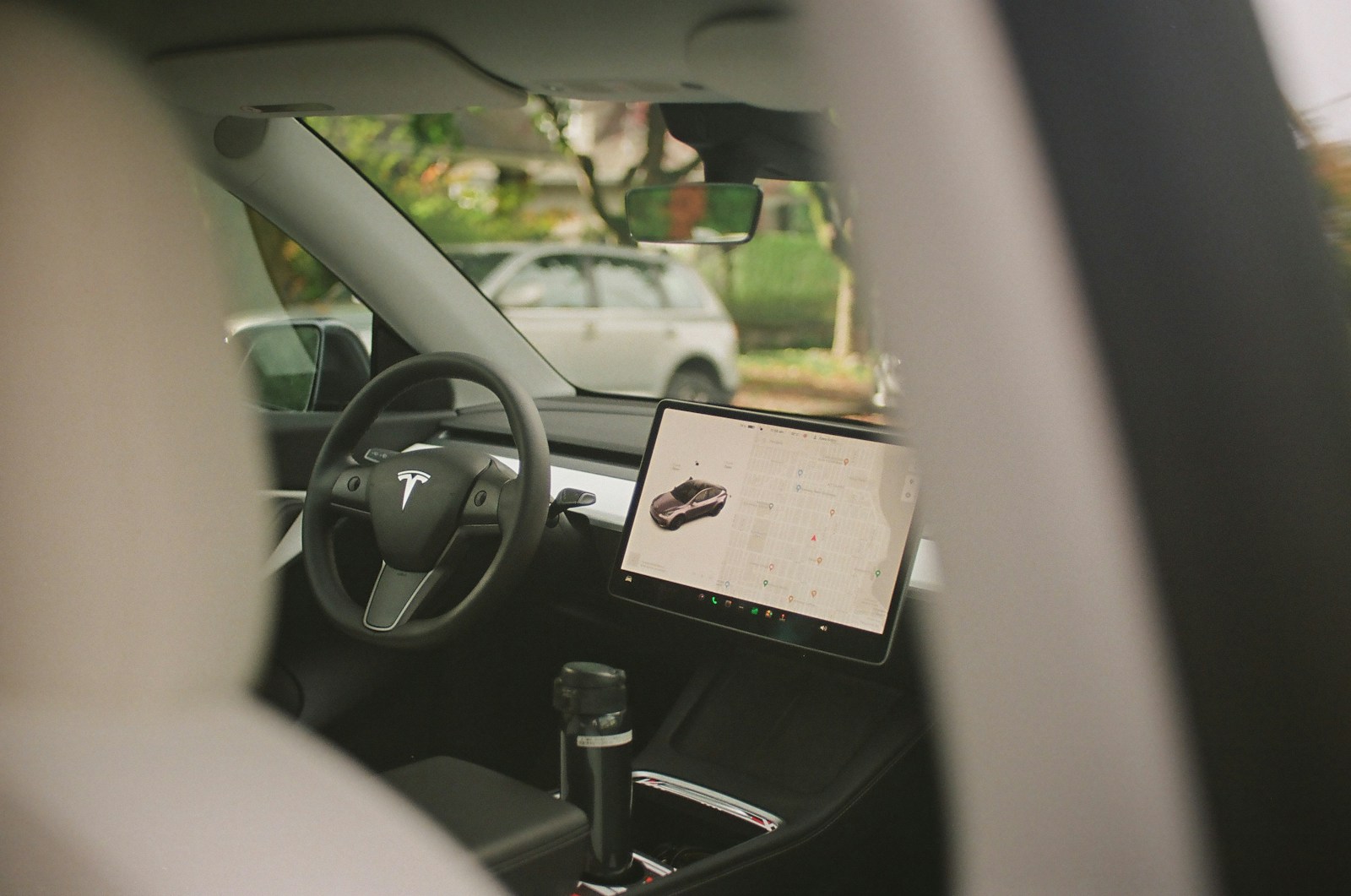 the dashboard of a car with a computer on it